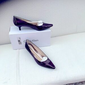 Women’s New Deep Burgundy patent leather Kitten pumps.